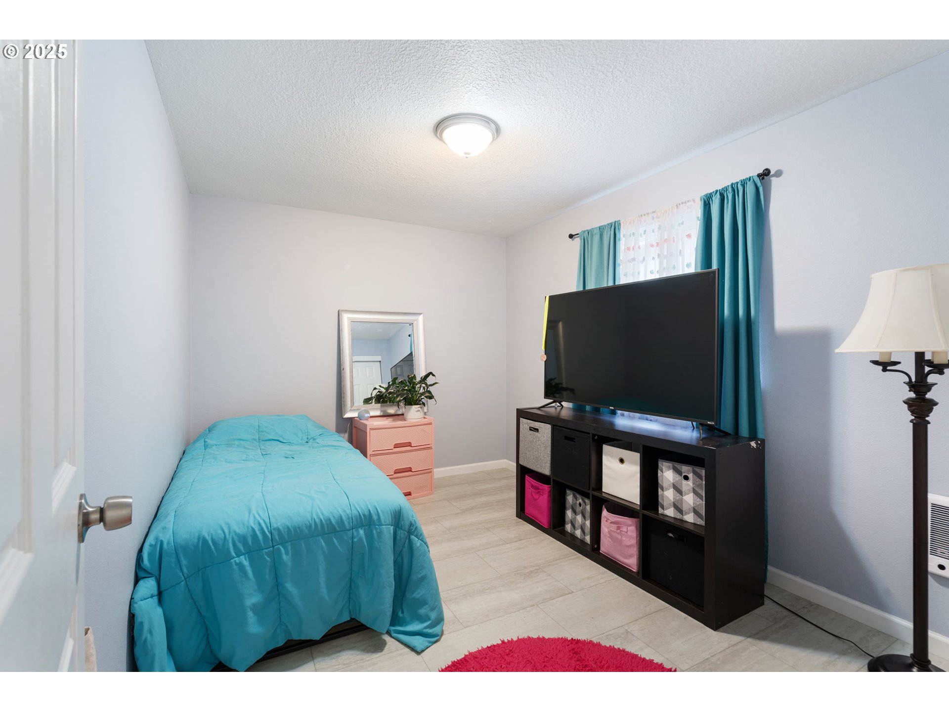 453 North 11th Street St. Helens, OR 97051 - Photo 13 of 20 a living room with furniture and a flat screen tv