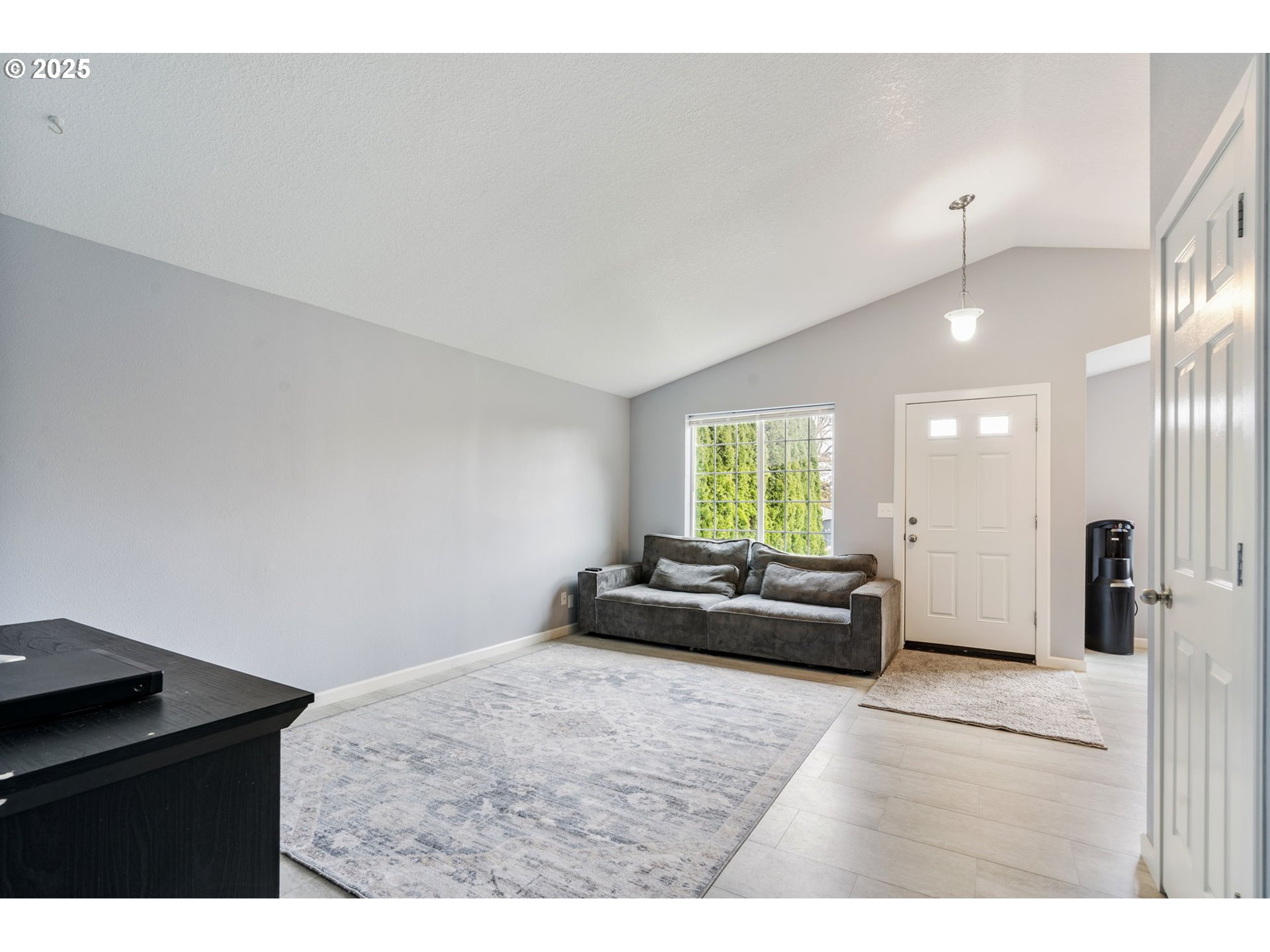 453 North 11th Street St. Helens, OR 97051 - Photo 6 of 20 a living room with furniture and a large window