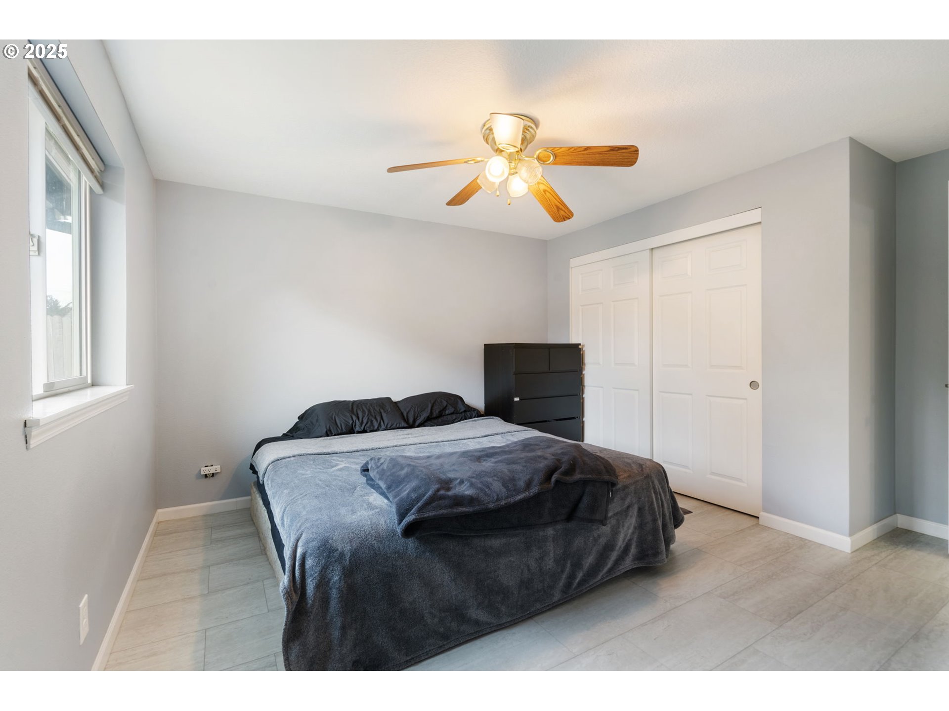 453 North 11th Street St. Helens, OR 97051 - Photo 10 of 20 a bedroom with a bed and a chandelier