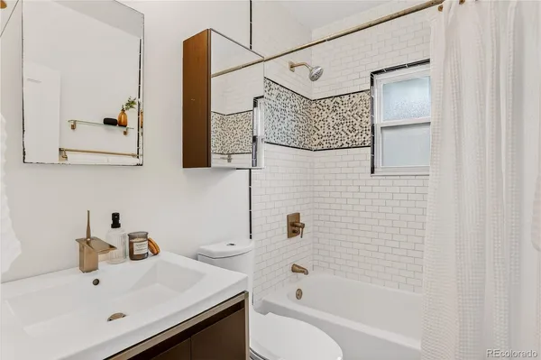 a bathroom with a sink and a bathtub