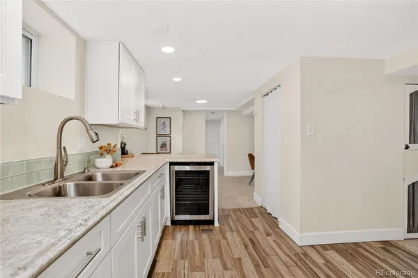 a kitchen with sink and cabinets