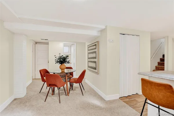 a view of a livingroom with furniture and a window