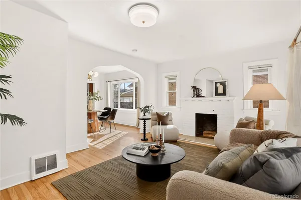 a living room with furniture and a fireplace