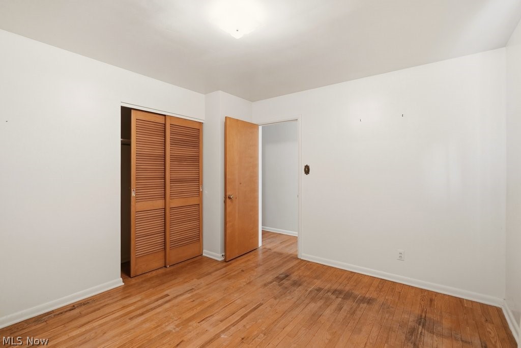 161 Pinehurst Road Munroe Falls, OH 44262 - Photo 22 of 40 Spacious room featuring wood-finish flooring and louvered bifold closet doors