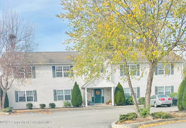 front view of a house with a street