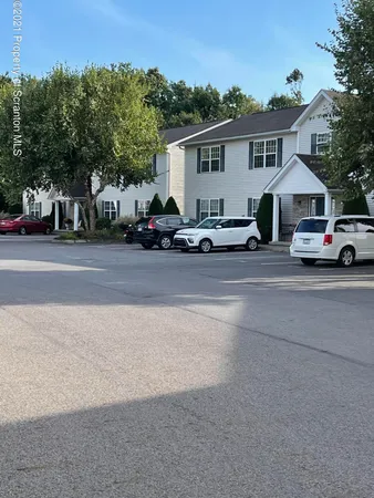a view of a car parked in front of a house