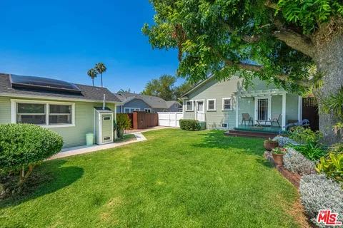 a front view of a house with a yard and porch