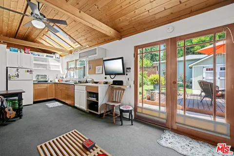 a view of kitchen with furniture and large window