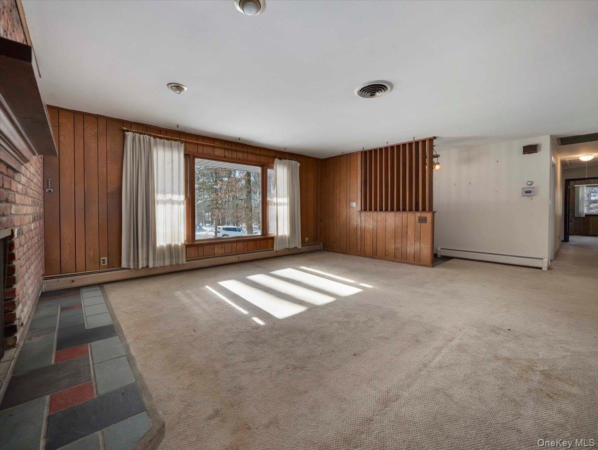 61 Rolling Ridge Road New City, NY 10956 - Photo 5 of 32 Large open Living room with picture window and brick fireplace