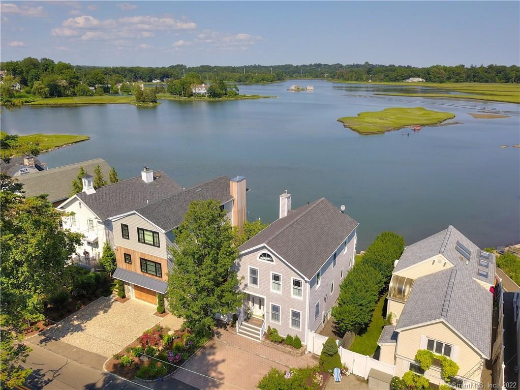 203 Hillspoint Road Westport, CT 06880 - Photo 1 of 1 an aerial view of residential houses with outdoor space and lake view