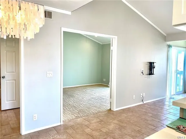 a view of a big room with windows and closet