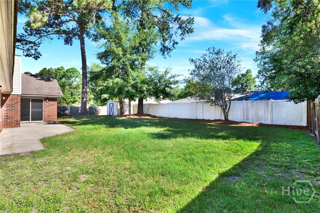 910 Old Mill Road Savannah, GA 31419 - Photo 38 of 41 Wonderful backyard with storage building for all your gardening tools!