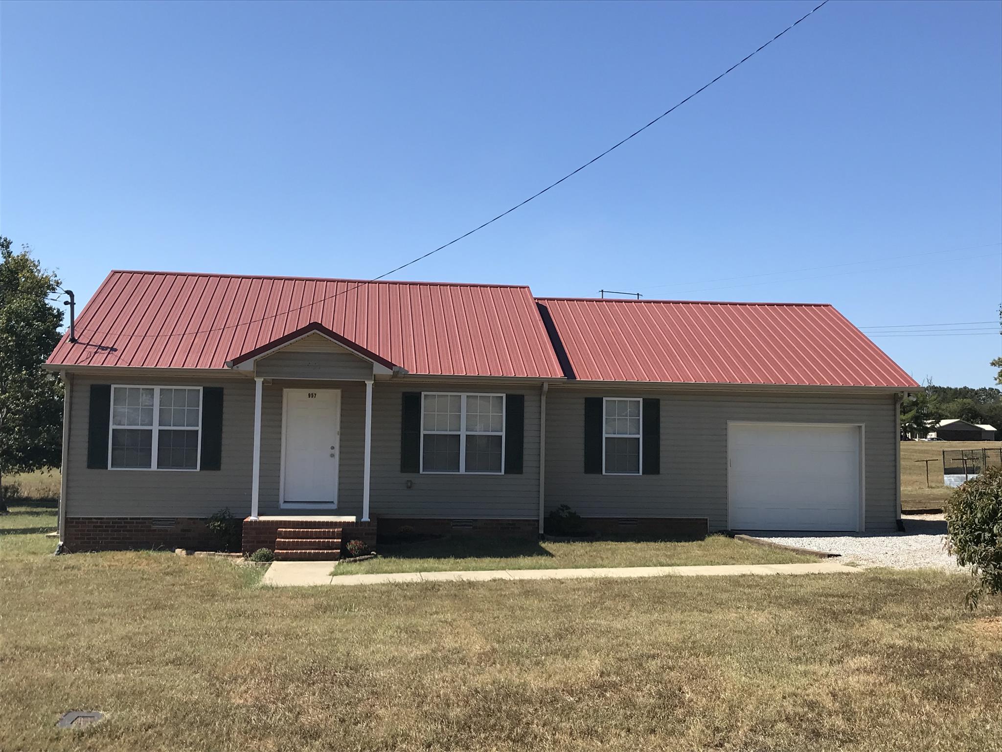 957 Shelly Road Decherd, TN 37324 - Photo 1 of 16 a front view of a house with a yard