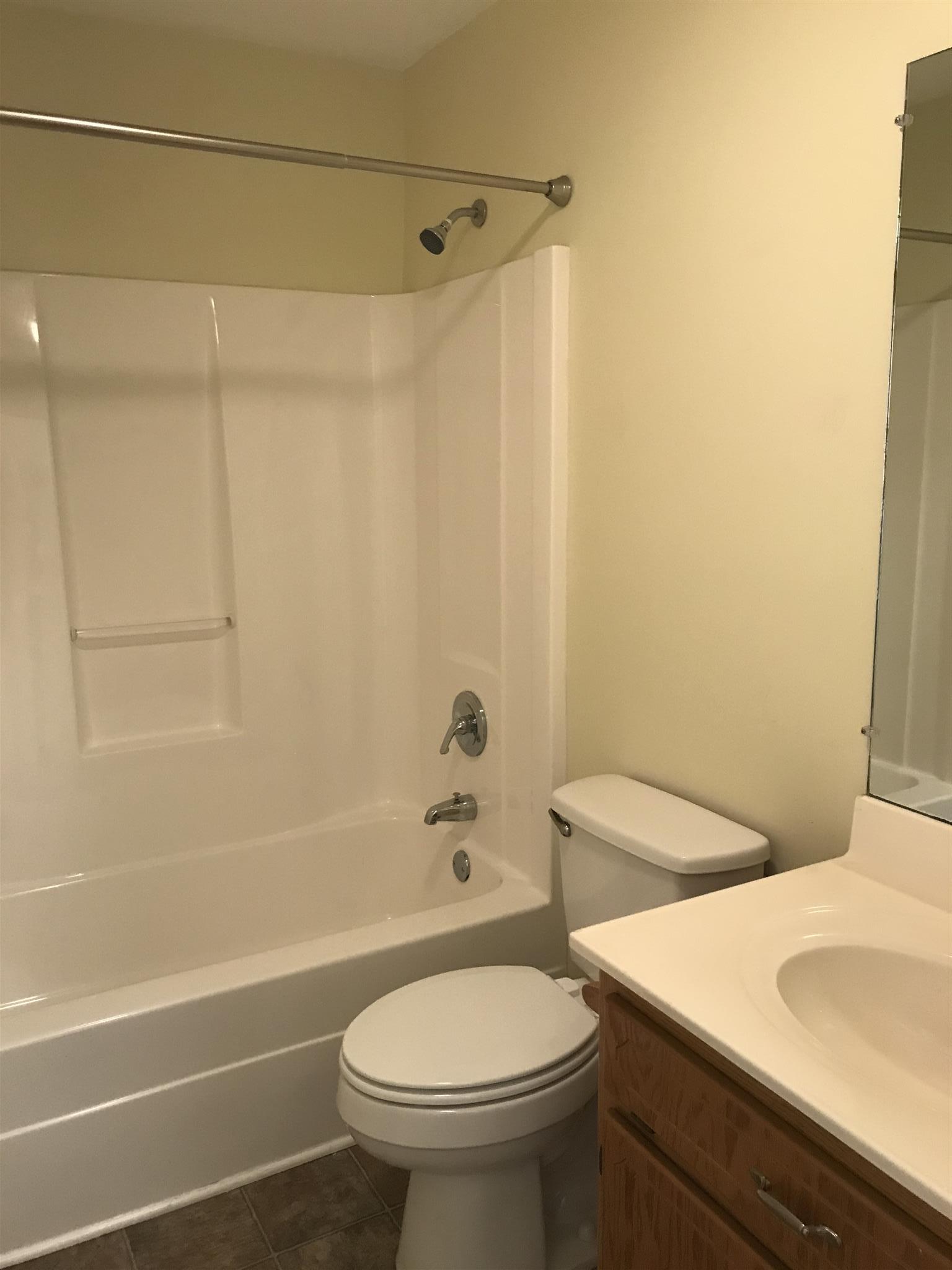 957 Shelly Road Decherd, TN 37324 - Photo 11 of 16 a bathroom with a sink a toilet and a bathtub
