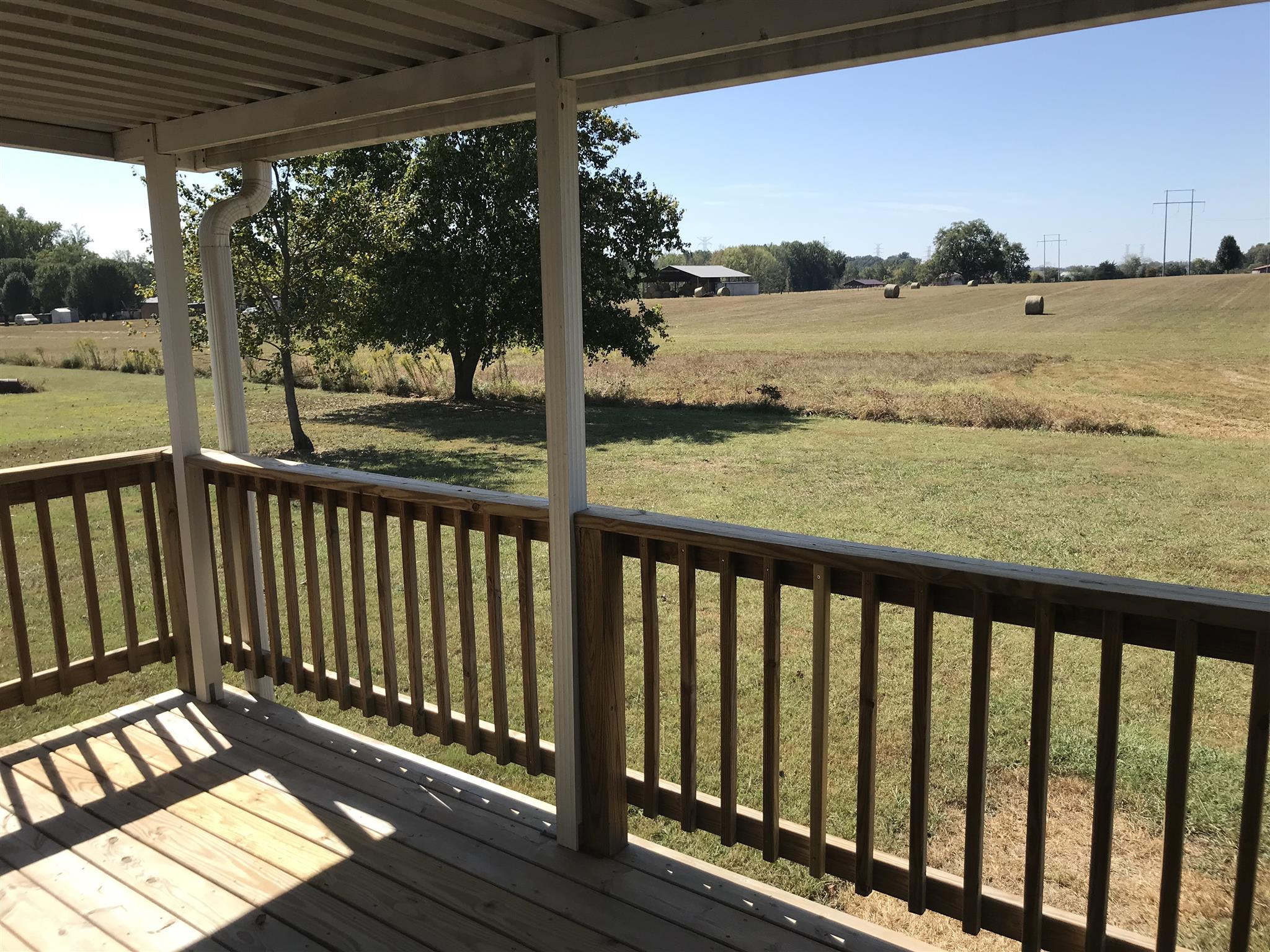 957 Shelly Road Decherd, TN 37324 - Photo 3 of 16 a view of a wooden deck with lake view