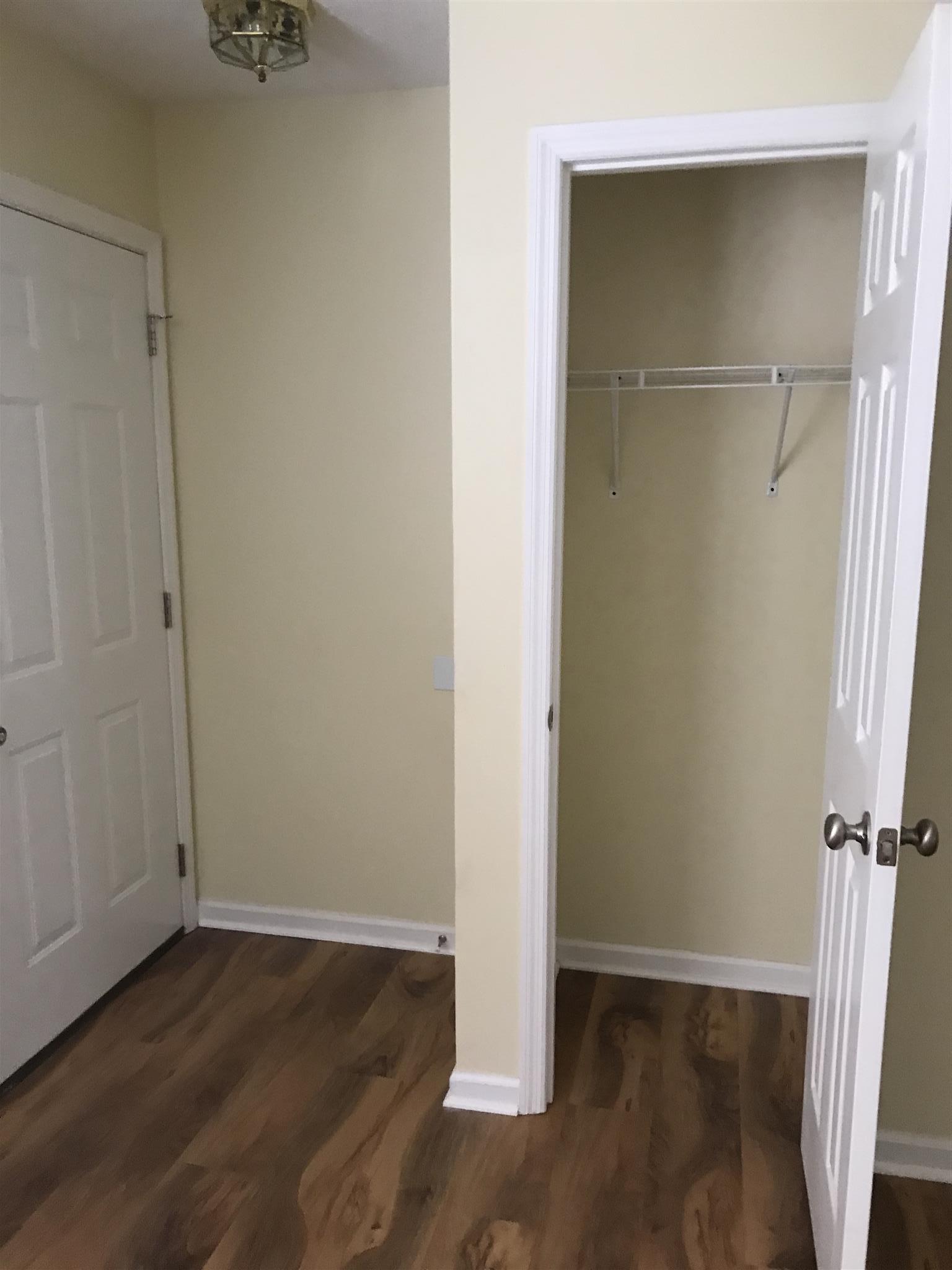 957 Shelly Road Decherd, TN 37324 - Photo 9 of 16 an empty room with wooden floor