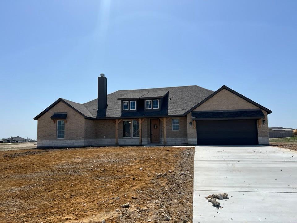 a house that has yard in front of it