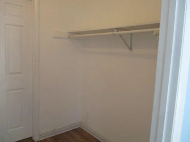 a view of an empty walk in closet
