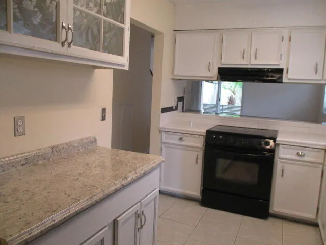 a kitchen with a stove and a sink
