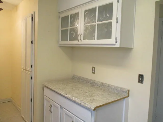 a bathroom with a sink and vanity