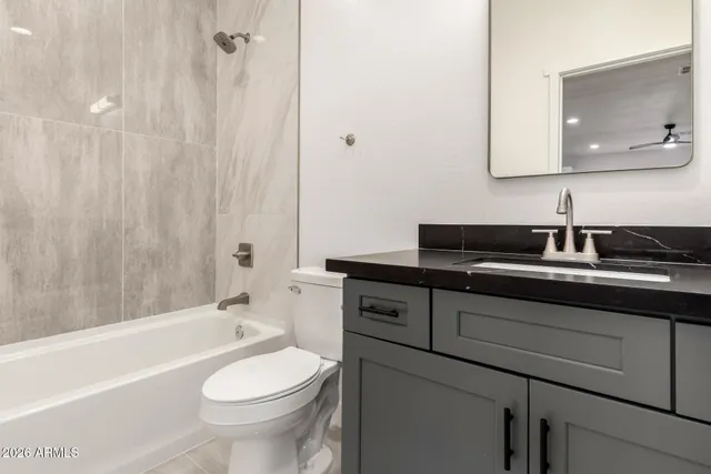 a bathroom with a sink a toilet and a bathtub