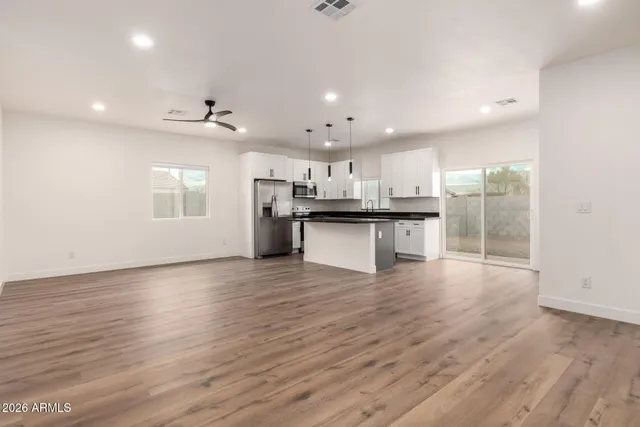 a view of kitchen with wooden floor and window