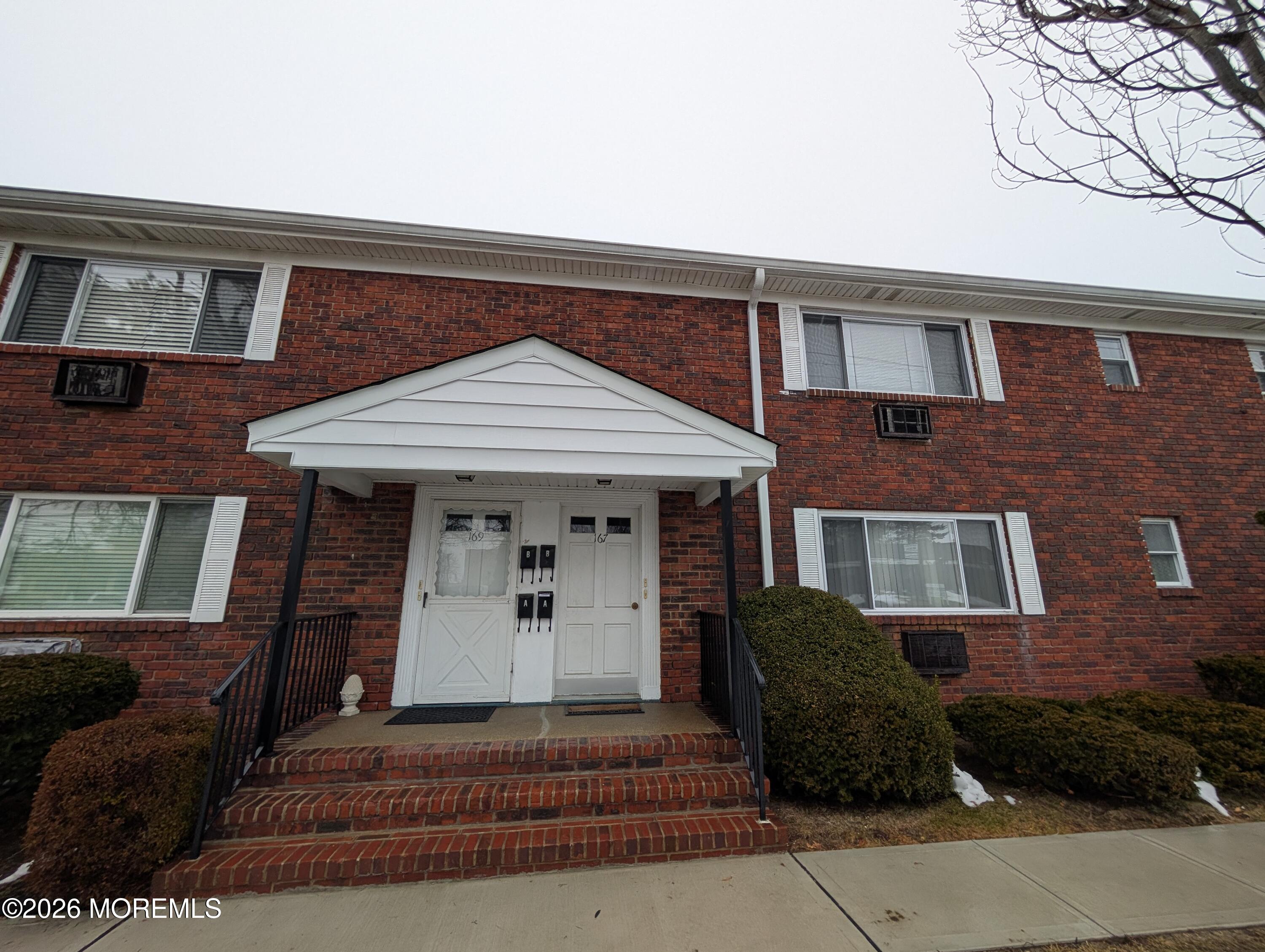 167 Wyckoff Road, Unit B Eatontown, NJ 07724 - Photo 13 of 15 a front view of a house with a yard