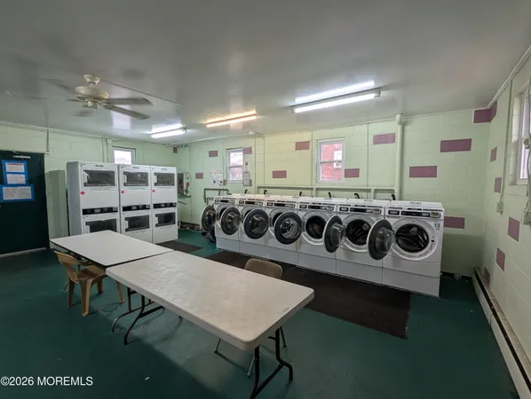 a kitchen with a table and chairs