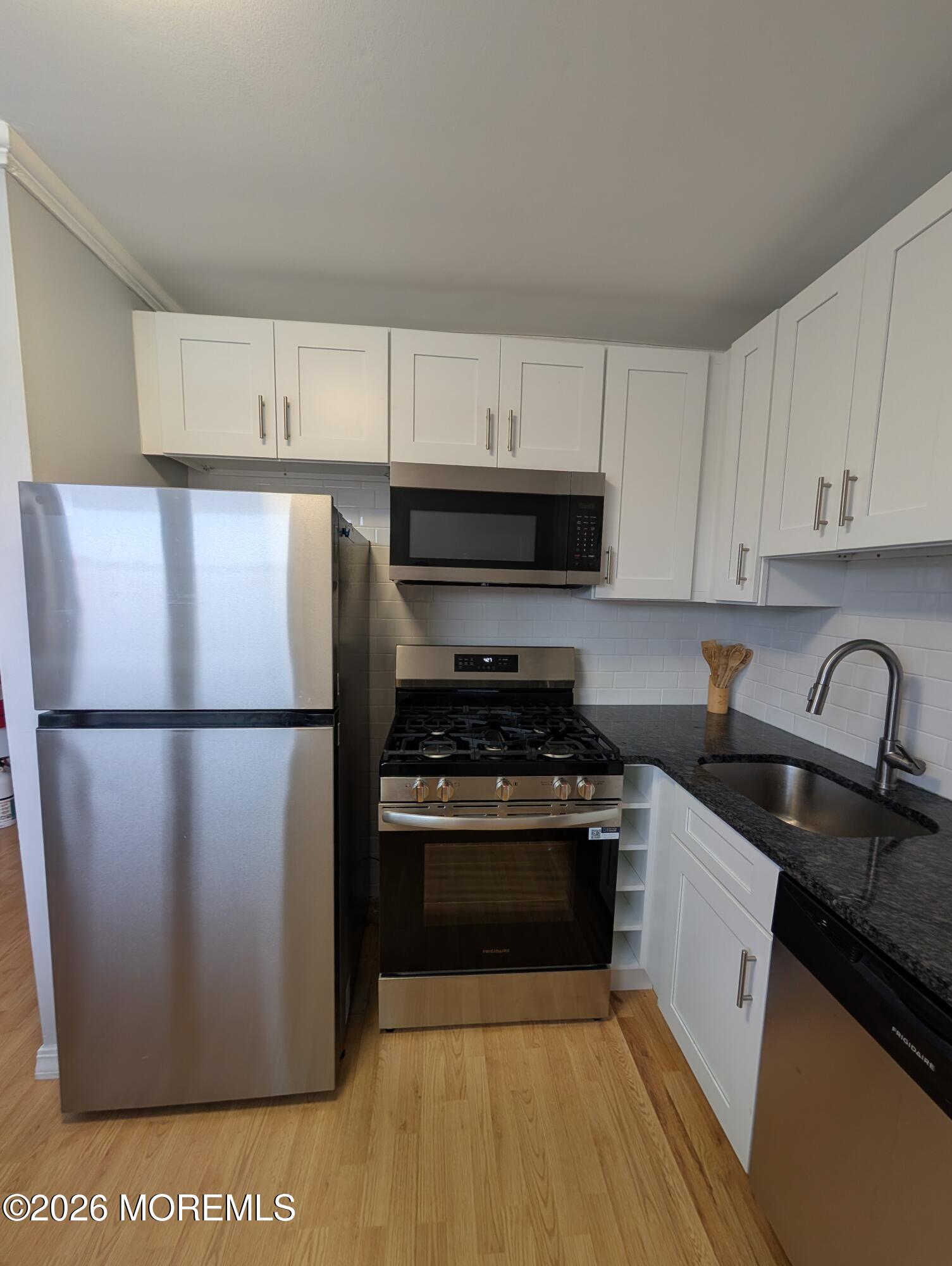 167 Wyckoff Road, Unit B Eatontown, NJ 07724 - Photo 2 of 15 a kitchen with a refrigerator stove and sink