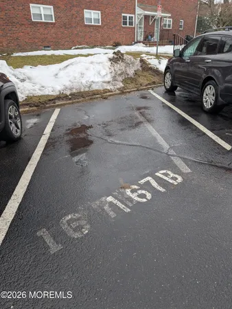 a view of a street with a car parked on road