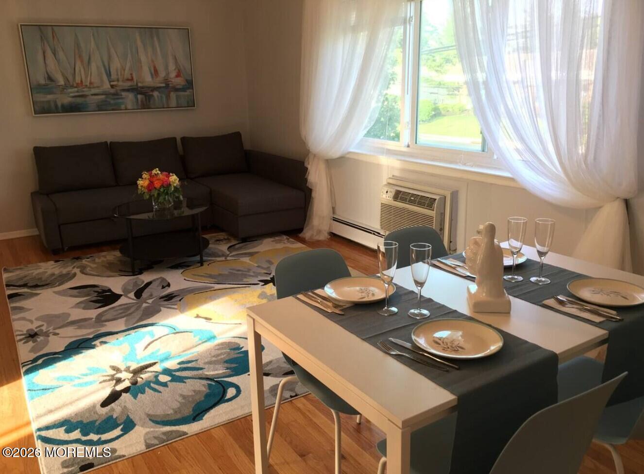 167 Wyckoff Road, Unit B Eatontown, NJ 07724 - Photo 6 of 15 a living room with furniture and a fireplace