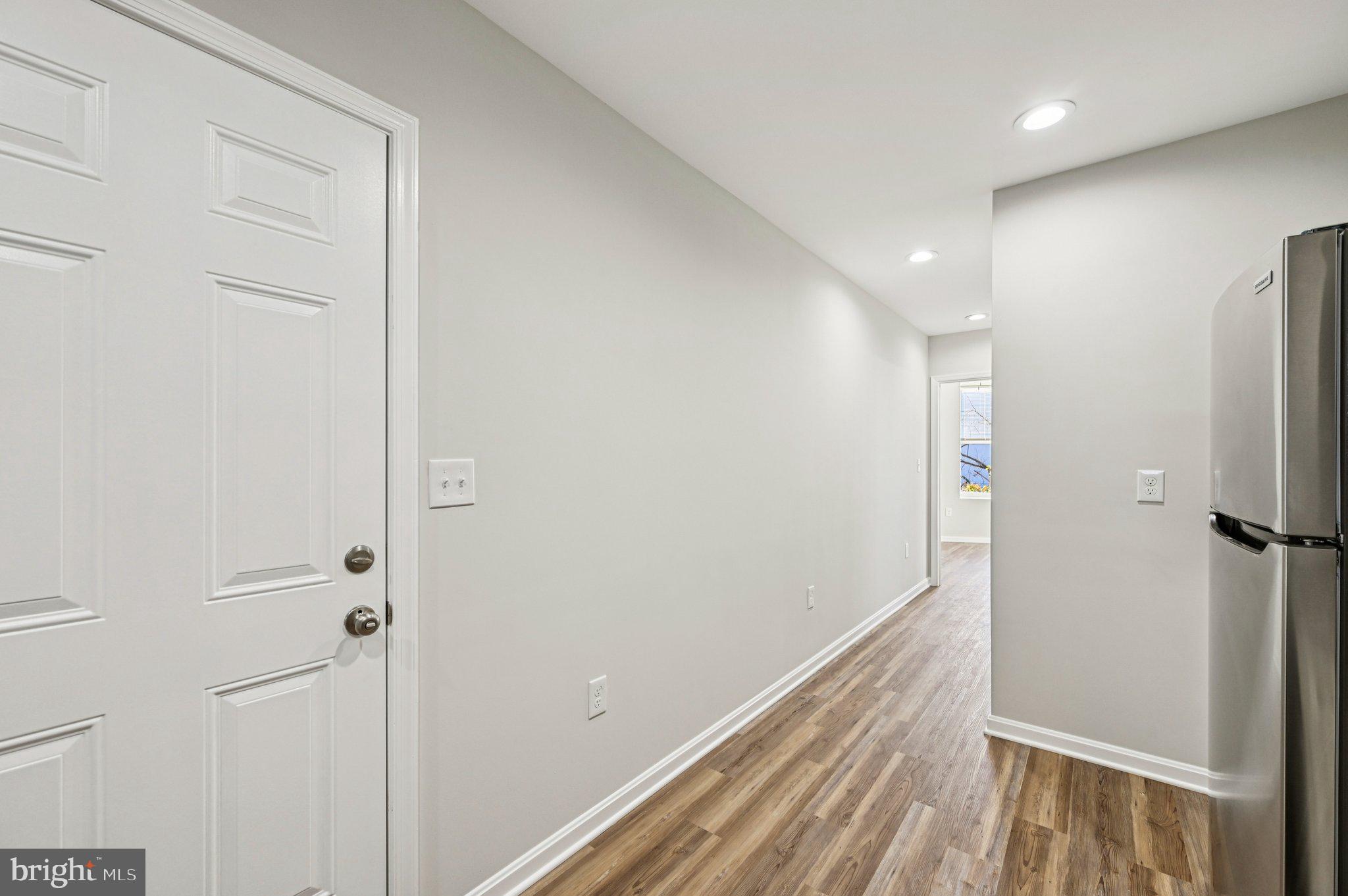 750 Reservoir Street, Unit B Baltimore, MD 21217 - Photo 12 of 25 a view of hallway with wooden floor