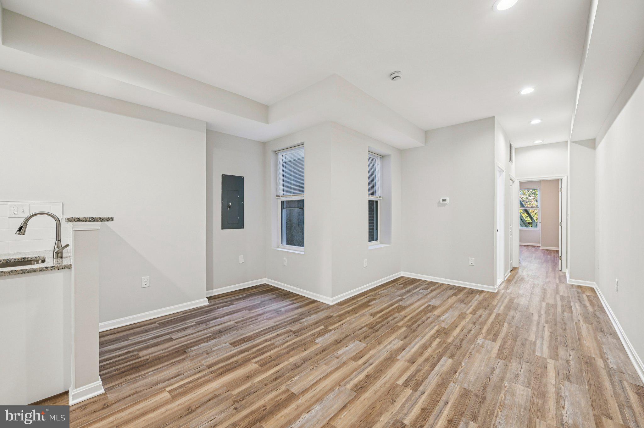 750 Reservoir Street, Unit B Baltimore, MD 21217 - Photo 7 of 25 a view of empty room with wooden floor