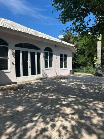 a view of a house with a tree