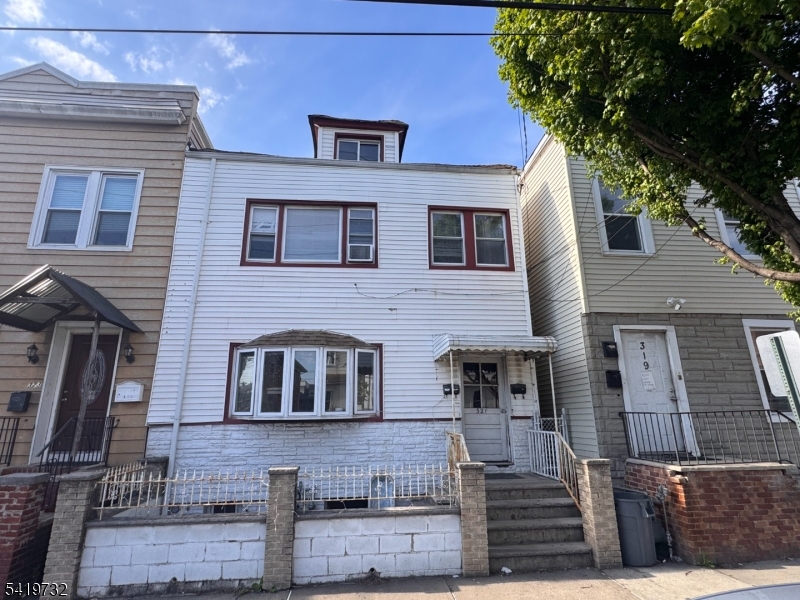 321 South 5th Street Elizabeth, NJ 07202 - Photo 1 of 10 a front view of a house with large windows