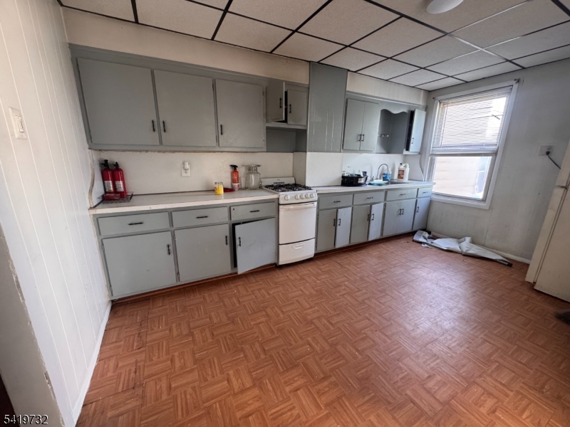 321 South 5th Street Elizabeth, NJ 07202 - Photo 3 of 10 a kitchen with a cabinets and window
