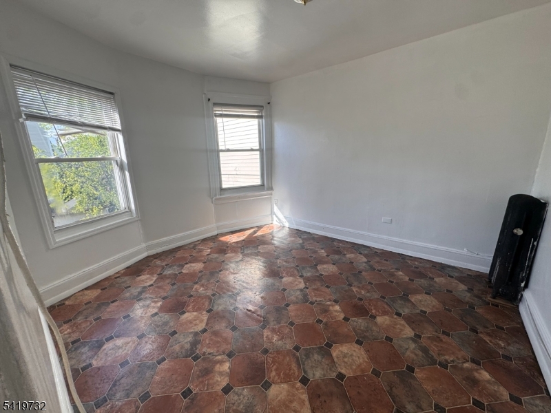 321 South 5th Street Elizabeth, NJ 07202 - Photo 7 of 10 a view of room with window and hardwood floor
