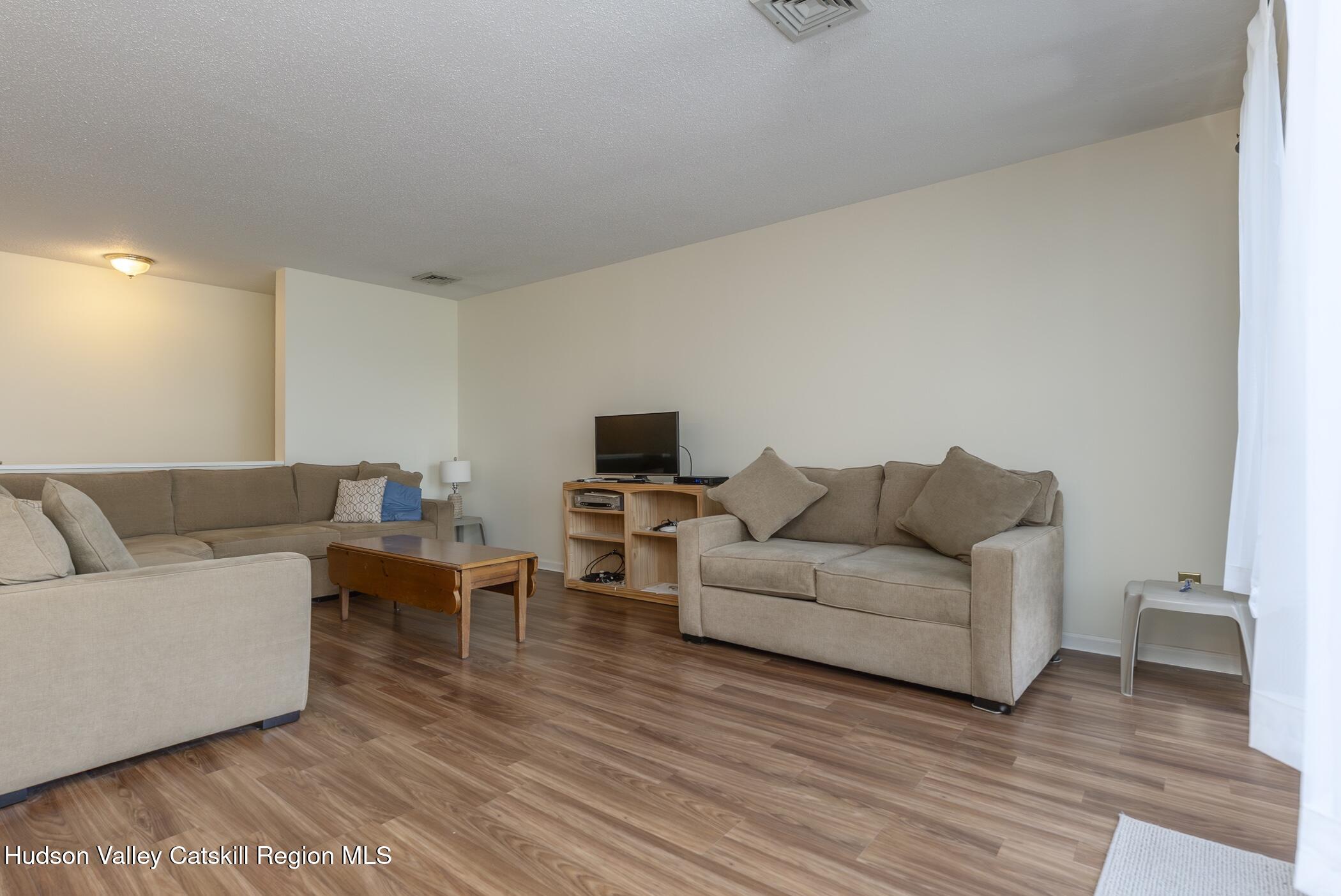 17 Riverview Port Ewen, NY 12487 - Photo 12 of 44 a living room with furniture and a flat screen tv