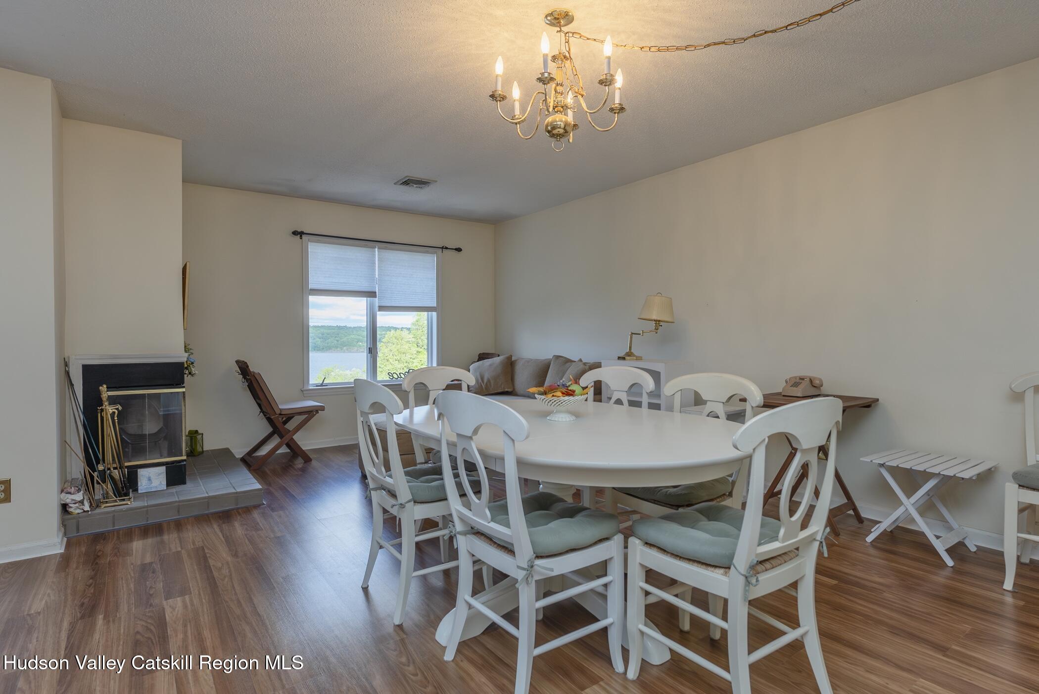 17 Riverview Port Ewen, NY 12487 - Photo 13 of 44 a view of a dining room with furniture wooden floor and chandelier
