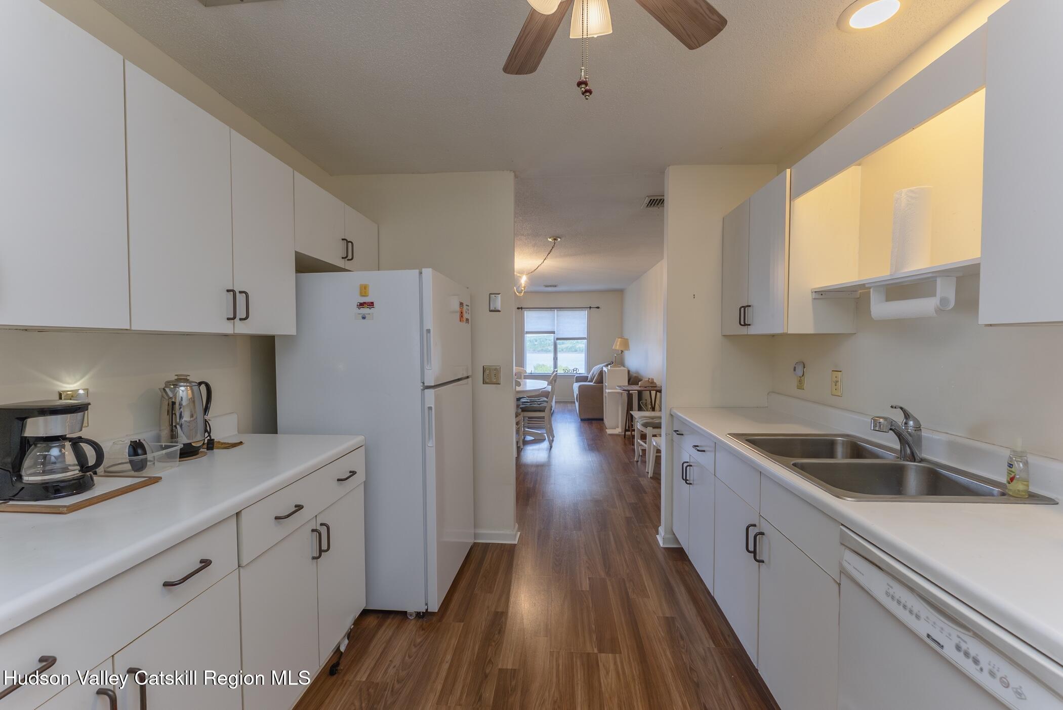 17 Riverview Port Ewen, NY 12487 - Photo 17 of 44 a kitchen with sink a refrigerator and cabinets
