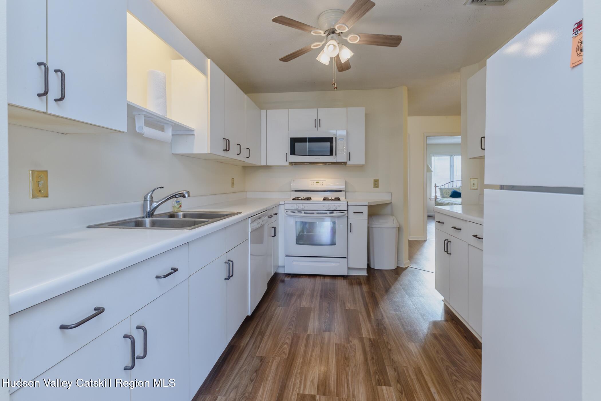 17 Riverview Port Ewen, NY 12487 - Photo 18 of 44 a kitchen with stainless steel appliances a sink cabinets and wooden floor