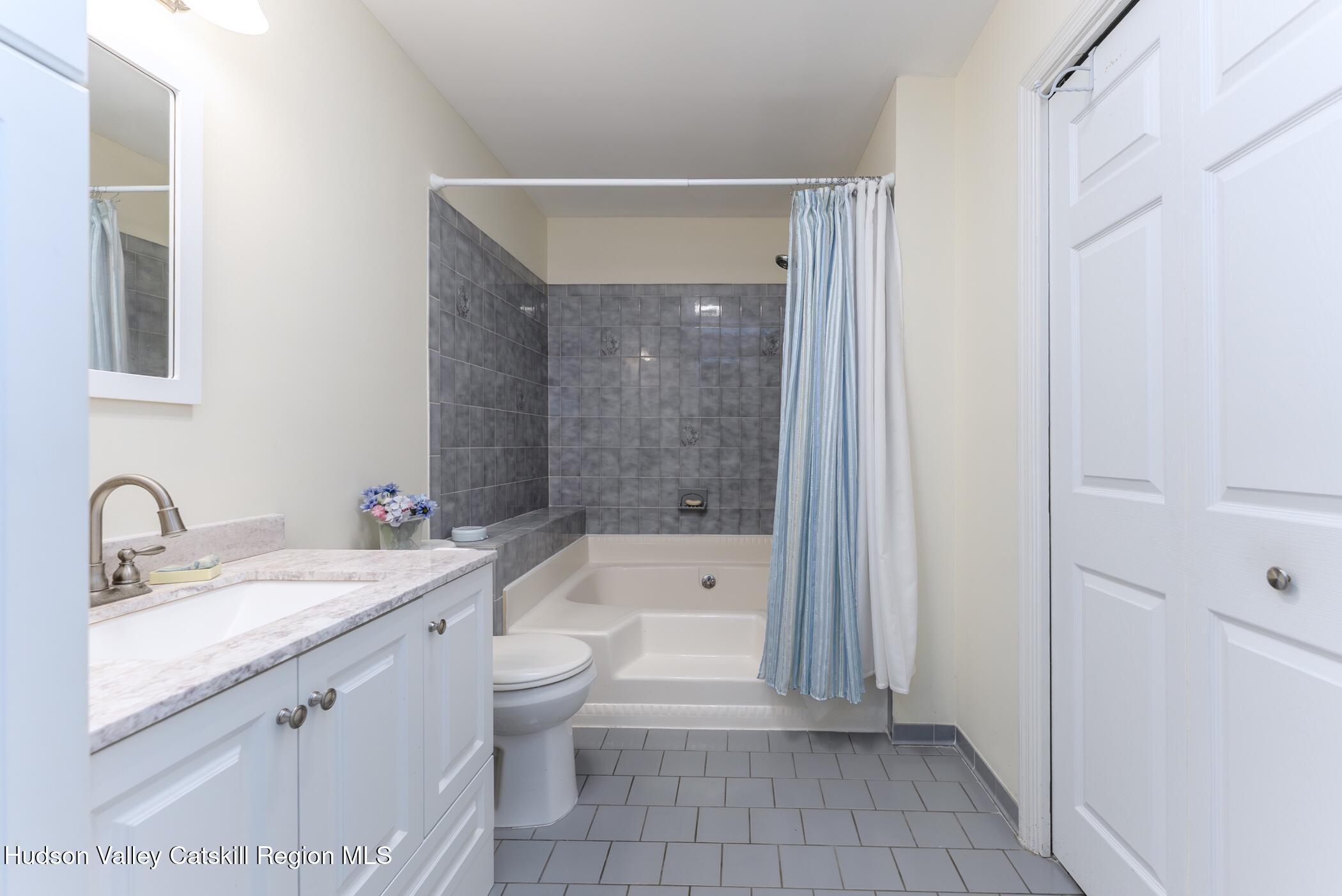 17 Riverview Port Ewen, NY 12487 - Photo 22 of 44 a bathroom with a granite countertop sink a toilet and bathtub