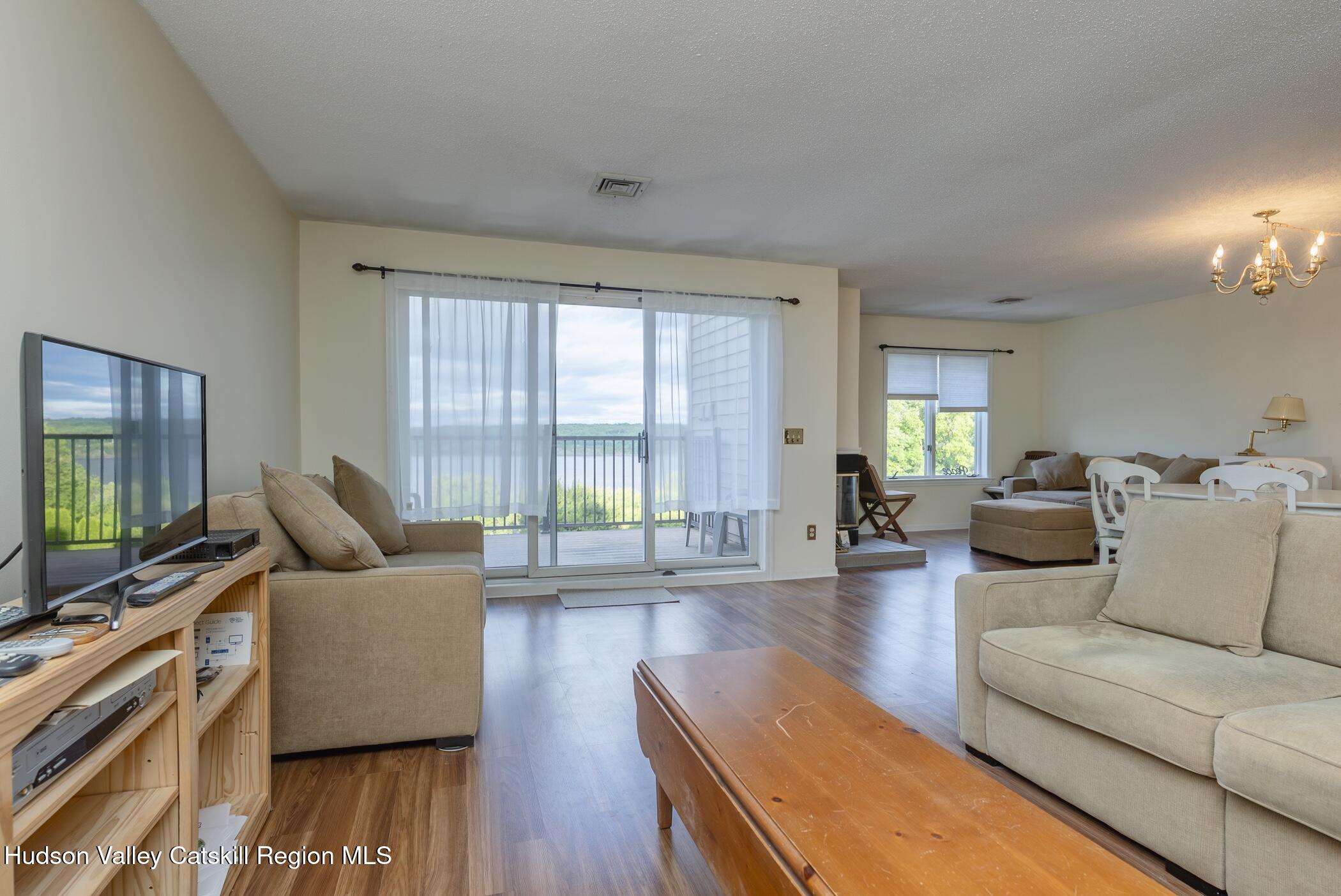 17 Riverview Port Ewen, NY 12487 - Photo 7 of 44 a living room with furniture and a flat screen tv