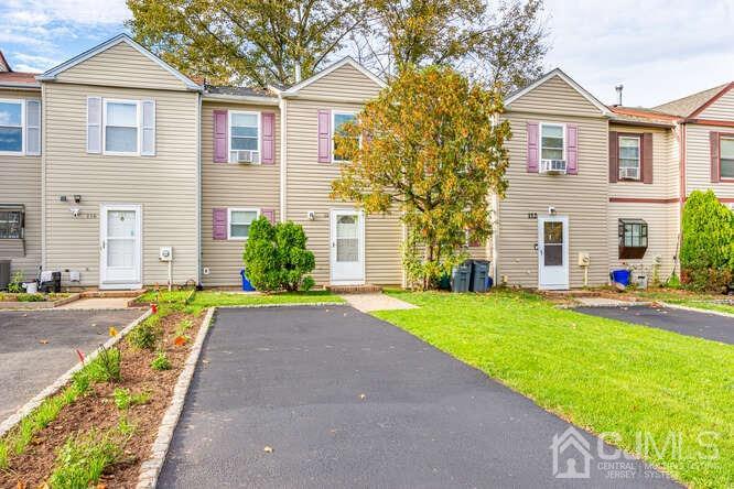 114 Redbud Road Piscataway, NJ 08854 - Photo 1 of 28 a front view of a house with a yard and garage