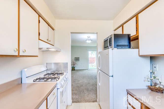 114 Redbud Road Piscataway, NJ 08854 - Photo 12 of 28 a kitchen with stainless steel appliances granite countertop a refrigerator and a stove top oven