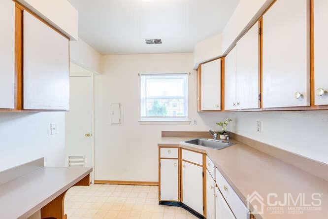 114 Redbud Road Piscataway, NJ 08854 - Photo 13 of 28 a room with a window and a sink