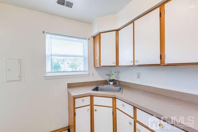 114 Redbud Road Piscataway, NJ 08854 - Photo 14 of 28 a bathroom with a sink and a window