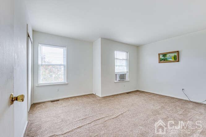 114 Redbud Road Piscataway, NJ 08854 - Photo 20 of 28 a view of an empty room with a window