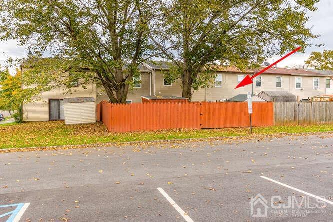 114 Redbud Road Piscataway, NJ 08854 - Photo 25 of 28 a front view of a house with a yard and garage