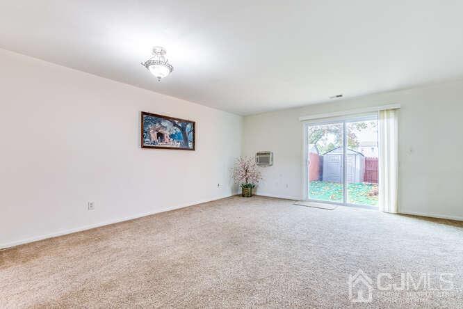 114 Redbud Road Piscataway, NJ 08854 - Photo 6 of 28 an empty room with windows and fan